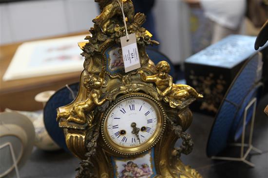 A 19th century French ormolu and Sevres style porcelain mantel clock, 21in.